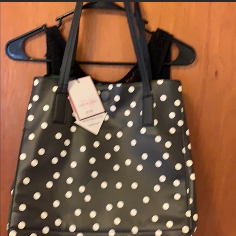 Black purse with white polka dots